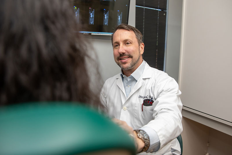Doctor Consulting with Patient about Veneers