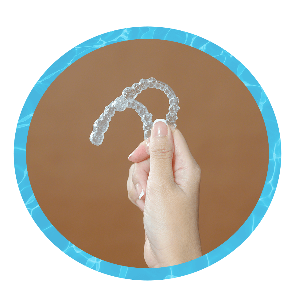 Woman holding a Pair of clear aligner