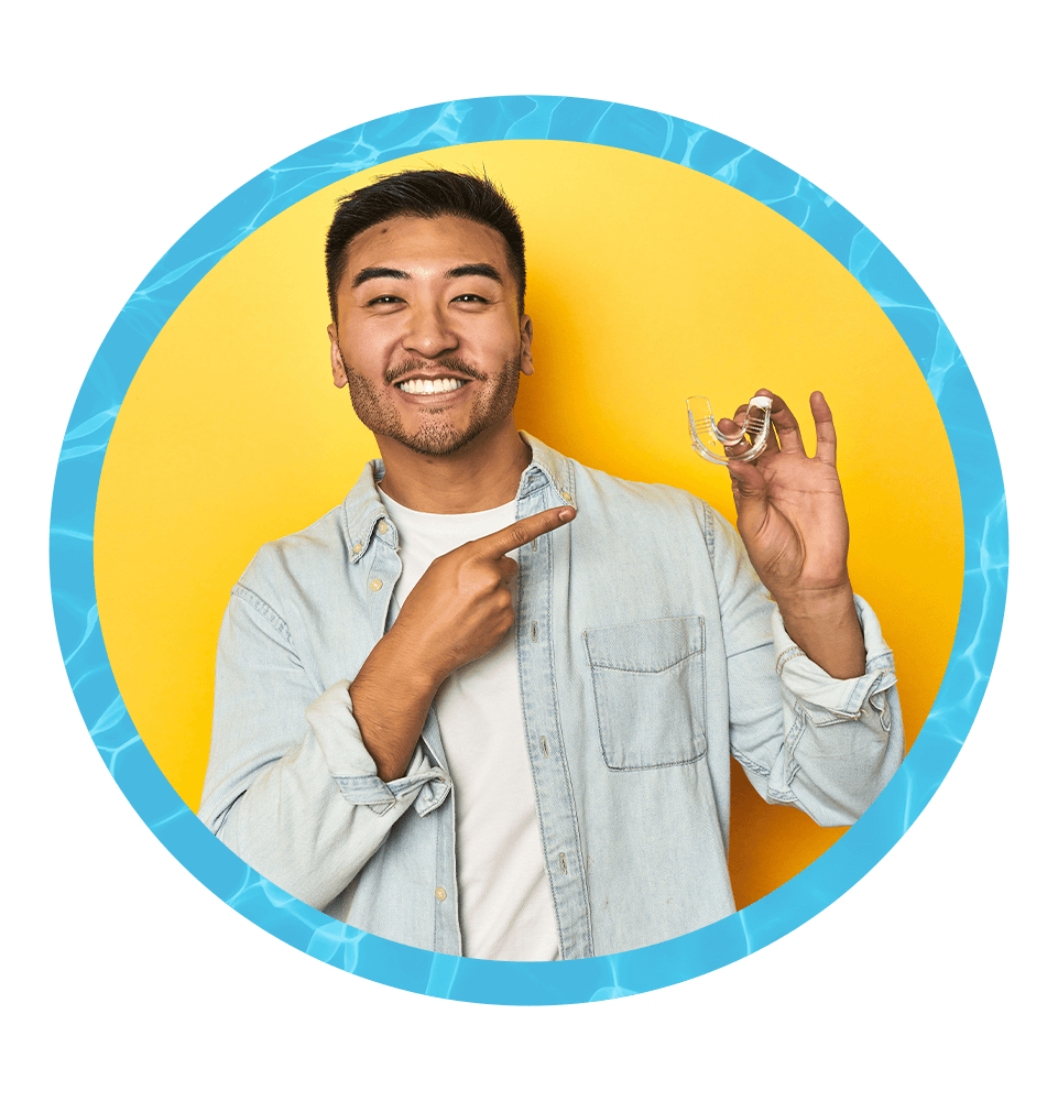 Man holding clear aligners