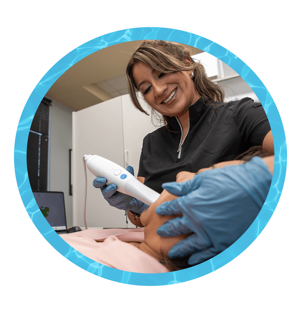 team member Giving a 3d scan of Patients teeth