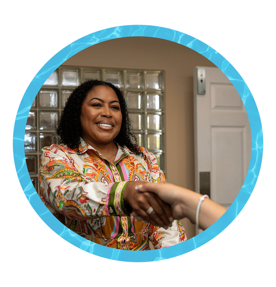 Patient shaking team member hand