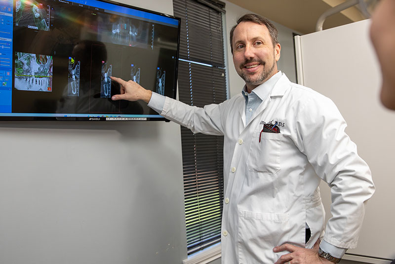Doctor pointing at dental x-ray