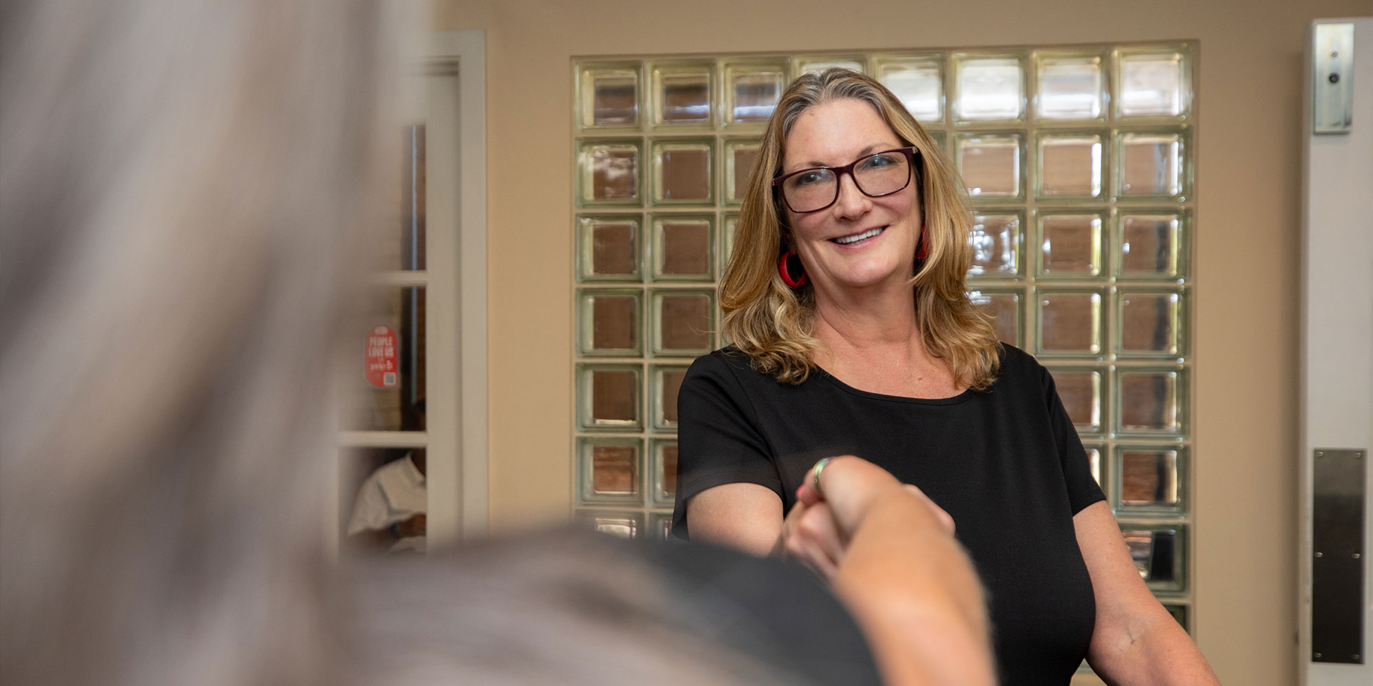 Patient shaking team member hand