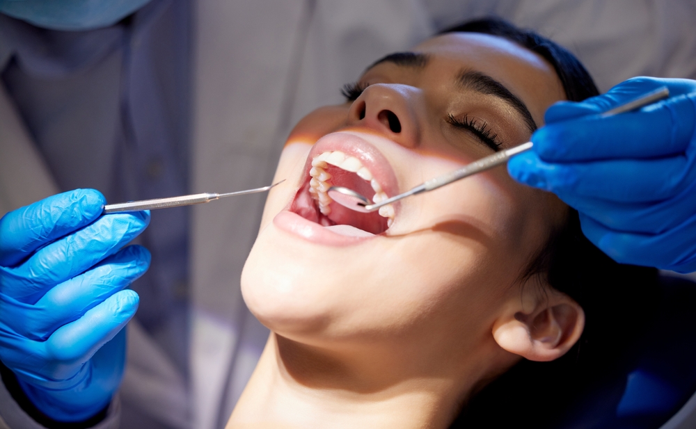 Dentist consulting with a patient at a modern dental office in Princeton, TX